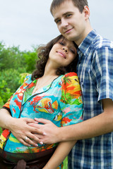 Beautiful young pregnant woman with husband