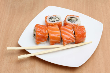 Red tasteful sushi on plate