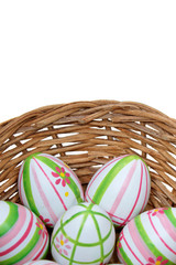 Easter eggs in a basket from bottom