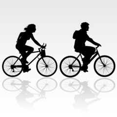 man and woman riding a bicycle