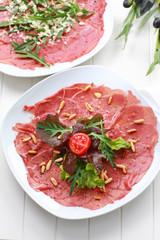 Carpaccio with salad and pine nut