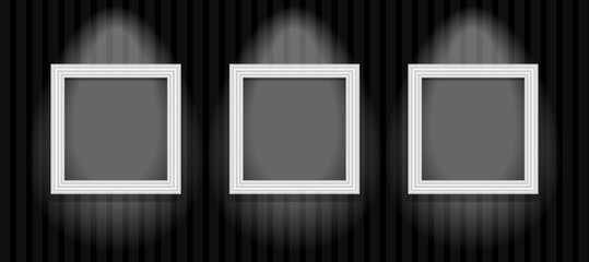 three frames on the dark wall
