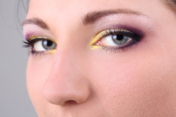 Close-up portrait of beautiful brunette with make up