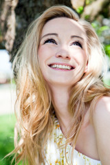 Naklejka premium beautiful young girl happy in summer outdoor