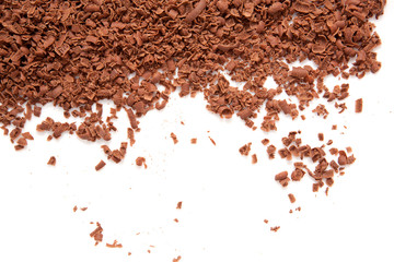 Scattered grated dark chocolate.  Isolated on white