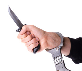 Male with a sharp knife in it's hand with a handcuff