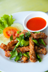 Deep fried pork with leech lime leaf and chili sauce