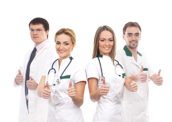 A team of young Caucasian doctors in white clothes