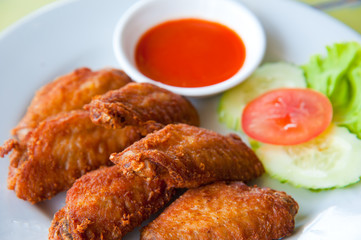deep fried spicy chicken wing with chili sauce