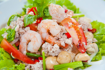 Thai dressed spicy salad with prawn, pork, green herbs and nuts