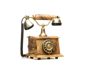 A beautiful old vintage telephone on a white background