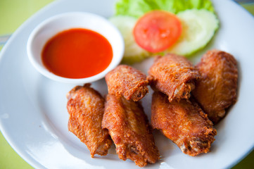 deep fried spicy chicken wing with chili sauce