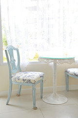 A vintage chair near a window