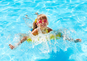 Child in swimming pool.