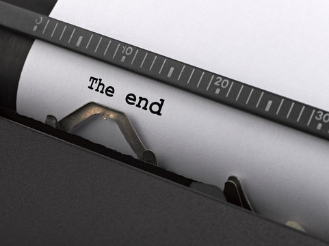 "The end" message typed by vintage typewriter.