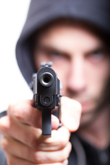 Man with gun, gangster, focus on the gun