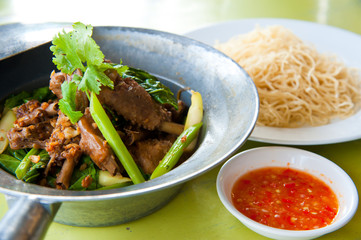 Baked goose with red pepper , chinese noodle and sauce