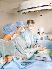 Patient on gurney in operating room.