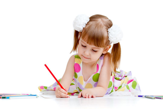 Cute girl drawing a picture with color pencils