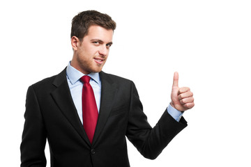 Young businessman with thumbs up