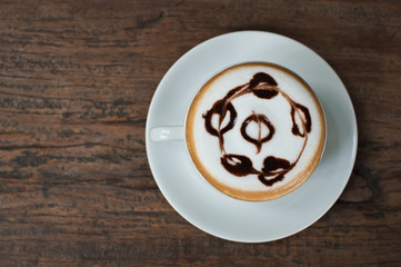 Coffee cup on wooden background