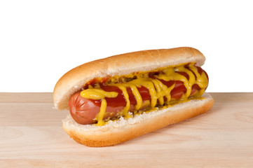 Homemade hot dog on a wooden board