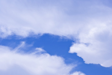 Naklejka na ściany i meble white clouds in blue sky.