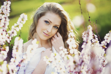 Fototapeta premium Portrait of romantic blond young woman outdoor