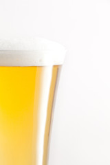 Glass full of beer and foam