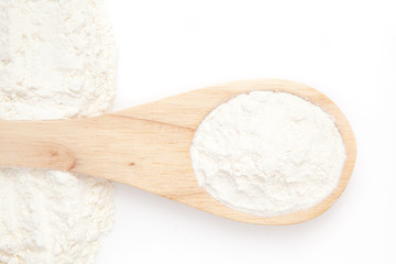 Wooden spoon with flour