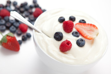 Bowl of cream with  fresh berries