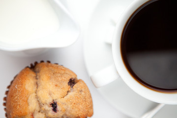 Cup of coffee with muffin