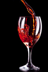 Empty glass being filled with wine