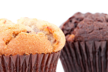 Close up of a regular muffin and a chocolate muffin