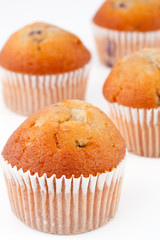 Four small baked muffins