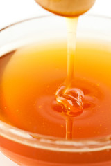 Close up of a thin honey trickle
