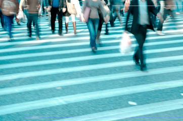 people crowd on zebra crossing street