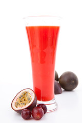 Full glass behind berries