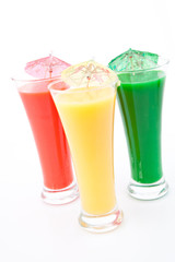 Three glasses with cocktail umbrella