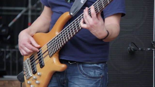 Man playing electrical bass guitar