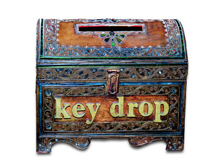 The Old wooden box of key drop isolated on  white background