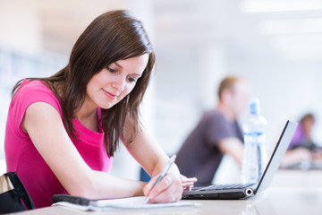in the library - pretty female student