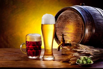  Beer barrel with beer glasses on a wooden table. © volff
