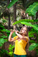 Girl playing the bamboo flute