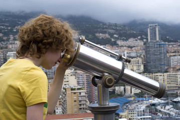 Girl looking through telescope