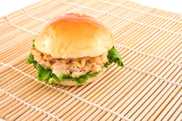 Fresh burger with tuna on a mat