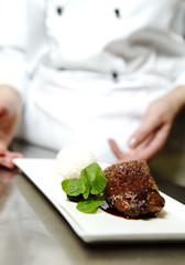 Chef in Restaurant Offers Dessert