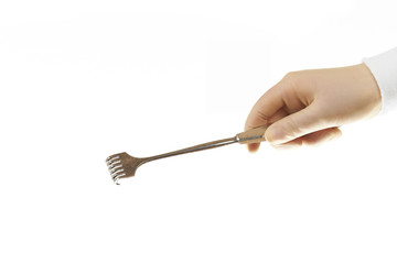 Surgical retractor held by sugeons hand isolated on white