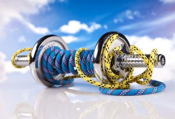 fitness steel dumbbells and colorful ropes