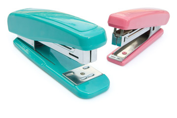 blue and pink staplers with clipping path